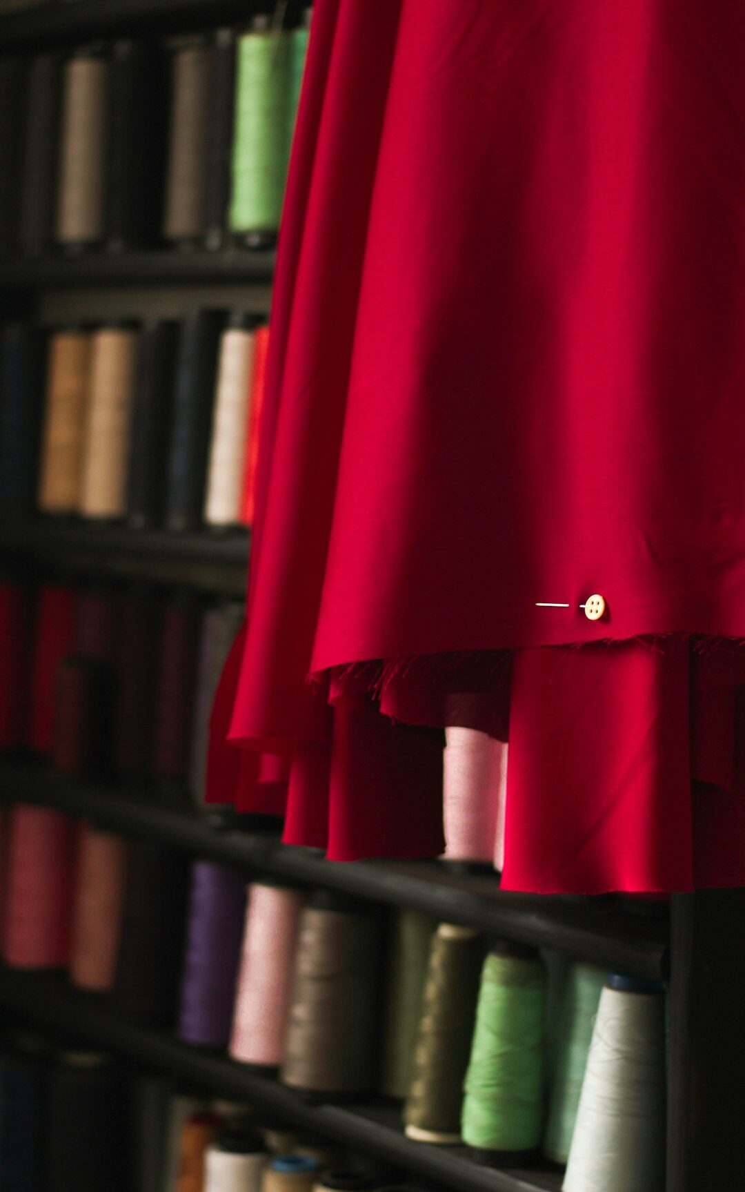 Rack of vintage haute couture garments in an atelier