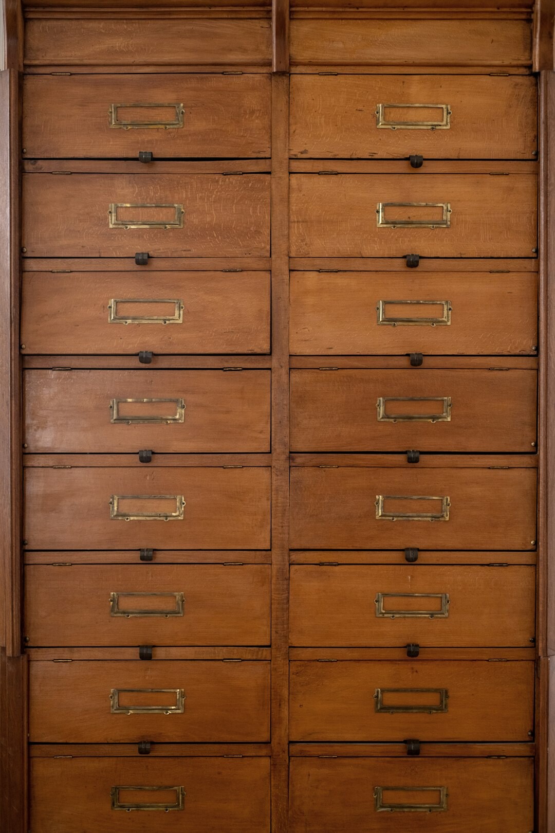Wooden archive cabinet with vintage photo folders