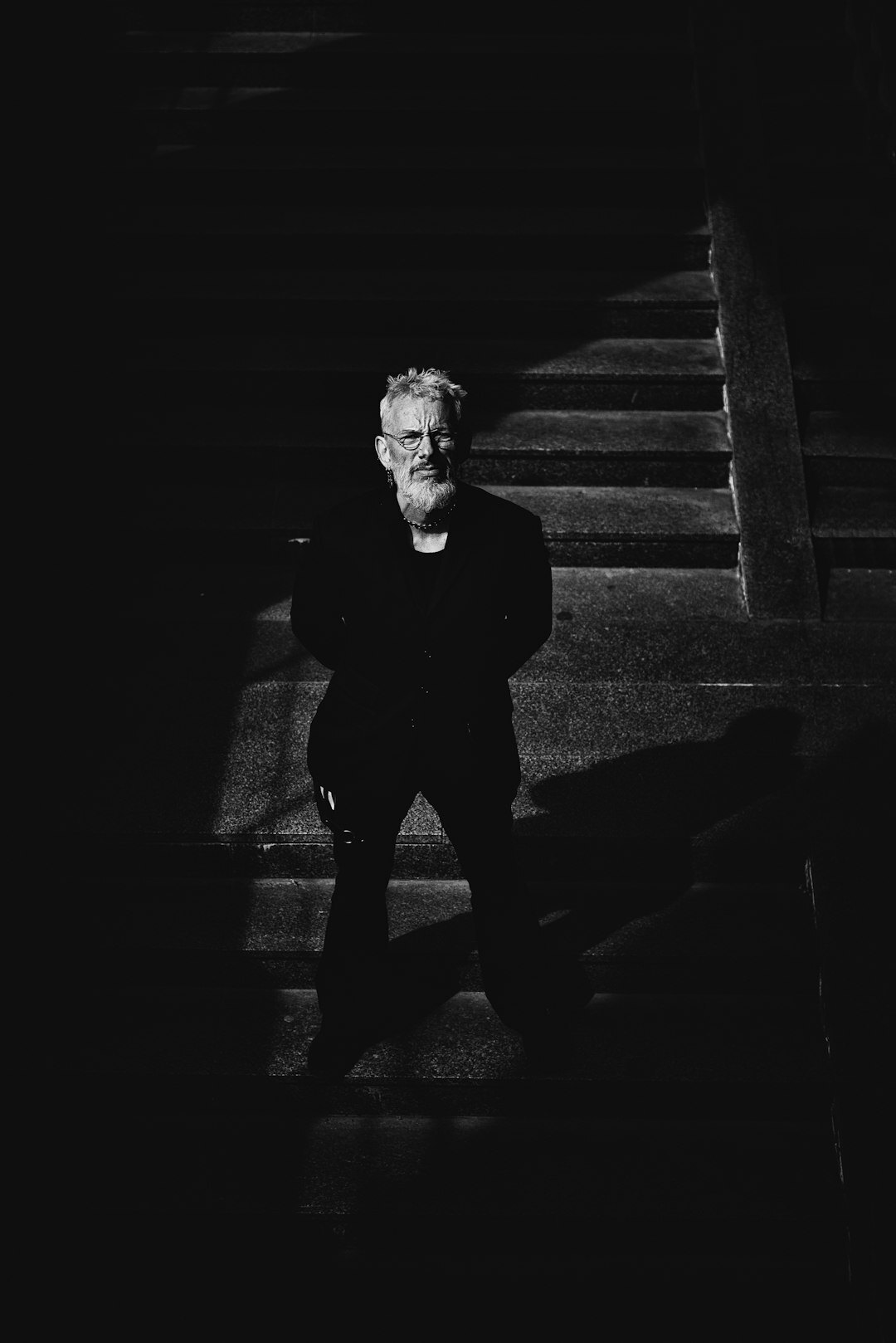 Formal portrait of a Dutch actor in a dark suit